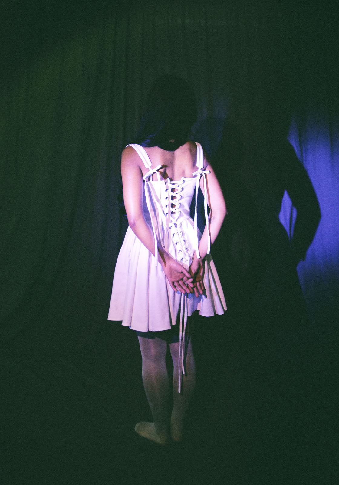 back of white cotton corset dress with gathered skirt and ribbon lace-up details by Mariana by Alba