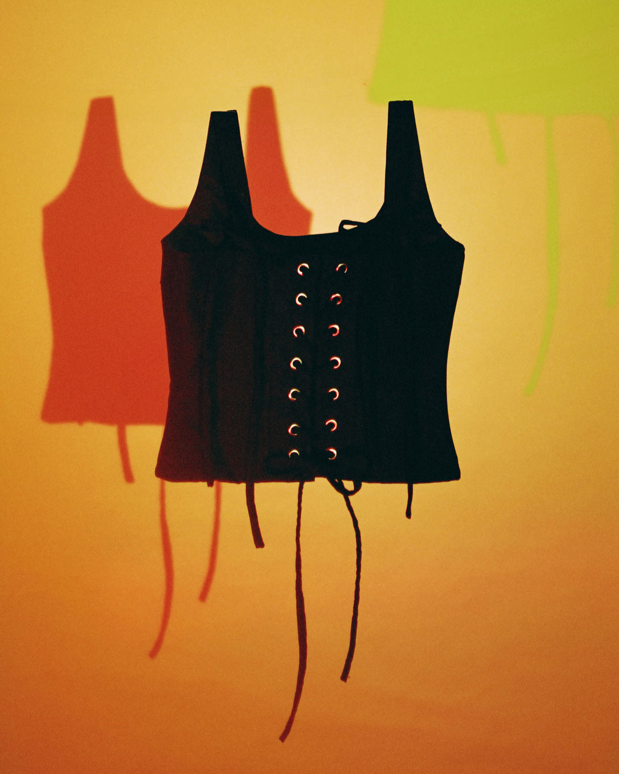 Black lace-up top on a colorful background